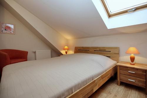 Postel nebo postele na pokoji v ubytování Feriendorf Papillon Wohnung 06-7