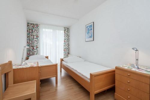 En eller flere senge i et værelse på Sünnslag Wohnung 087