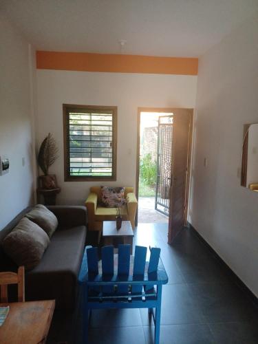 a living room with a couch and a table at Casa Naranja in San Lorenzo