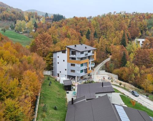 an aerial view of a house in the woods at Maiden Water Resort in Sarajevo