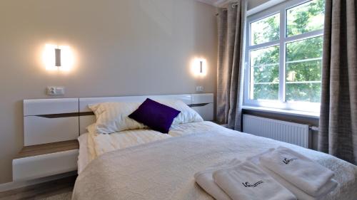 Ένα ή περισσότερα κρεβάτια σε δωμάτιο στο LC pokoje & apartamenty Z57