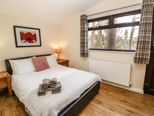 Ένα ή περισσότερα κρεβάτια σε δωμάτιο στο Snowdrop