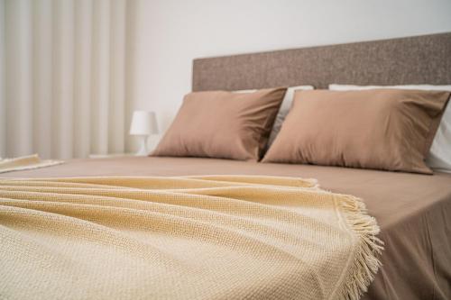מיטה או מיטות בחדר ב-Casas da Padaria