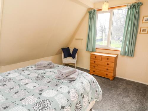 Ένα ή περισσότερα κρεβάτια σε δωμάτιο στο Netherscar