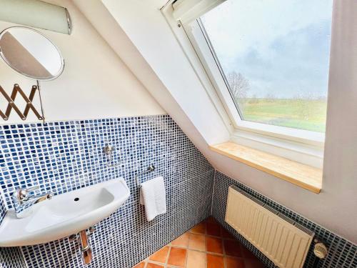 Ванная комната в Authentisches Inselhaus - ideal für Kiter/Surfer/Familien