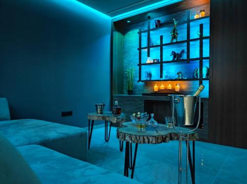 a room with a bed and a table at PentLux - SPA Penthouse in the heart of Skopje in Skopje