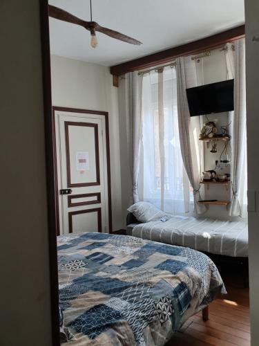 Una cama o camas en una habitación de B & B Les Secrets des Loges