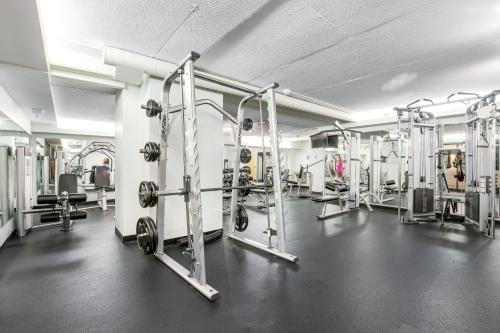 a gym with several weight machines in a room at Sea Colony --- 508 Brandywine house in Bethany Beach