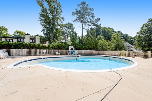 a swimming pool in a yard with a fence at Sea Colony --- 508 Brandywine house in Bethany Beach