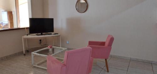 Televízia a/alebo spoločenská miestnosť v ubytovaní Pousada Belvedere