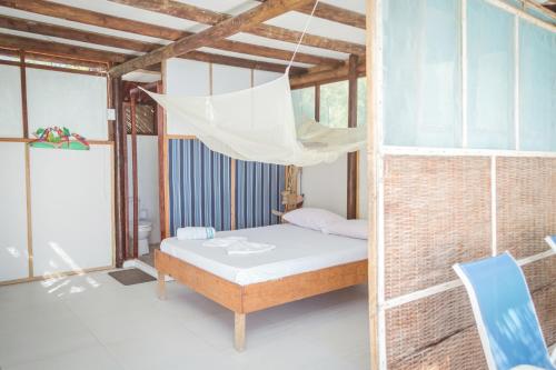 Двухъярусная кровать или двухъярусные кровати в номере El Hamaquero Hostal EcoNativo