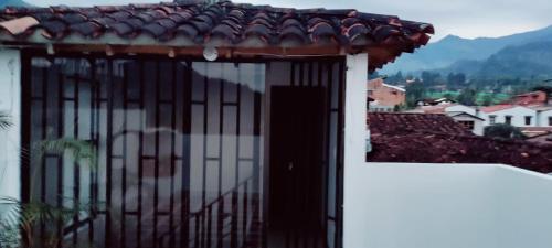 a door with a roof on top of a building at Rosita 2 in Jardin