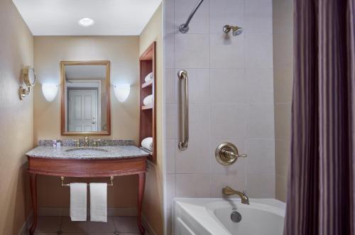 a bathroom with a sink, toilet and bathtub at Harrah's Metropolis Hotel & Casino in Metropolis