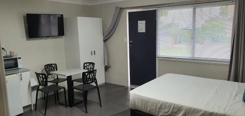 Postel nebo postele na pokoji v ubytování Wynnum Anchor Motel