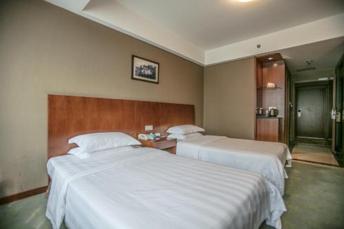 Krevet ili kreveti u jedinici u objektu Huangshan Tiandu International Hotel