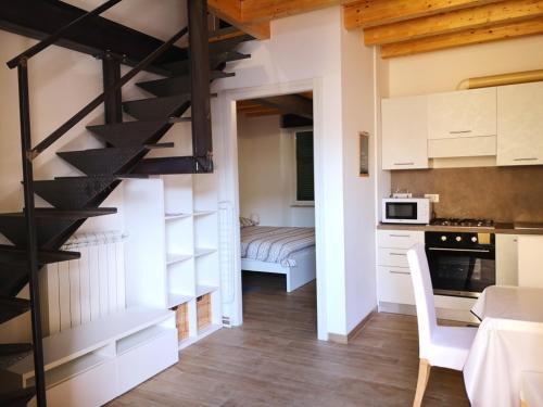 a kitchen with a spiral staircase in a room at FLATS 15 - New Opening in Rome