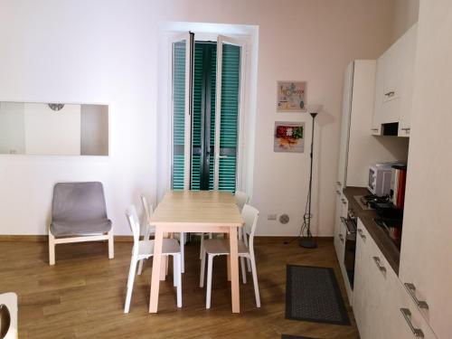 a kitchen with a table and chairs in a room at FLATS 15 - New Opening in Rome