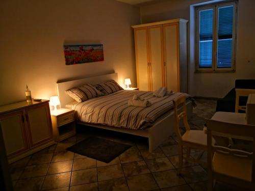 a bedroom with a bed and a table with a chair at FLATS 15 - New Opening in Rome