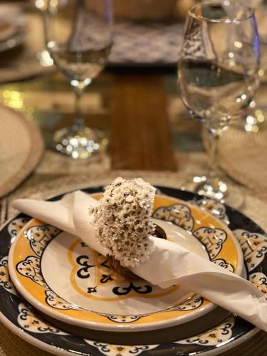 a plate with a piece of cake on a table at Villa Lulu Geribá in Búzios
