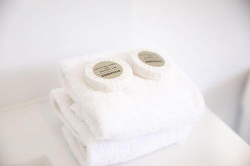 two rolls of white towels with stickers on them at Audrey Wilkinson Vineyard in Pokolbin