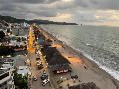 a view of a beach with a crowd of people at Apartamento en Atacames con vista al mar in Atacames