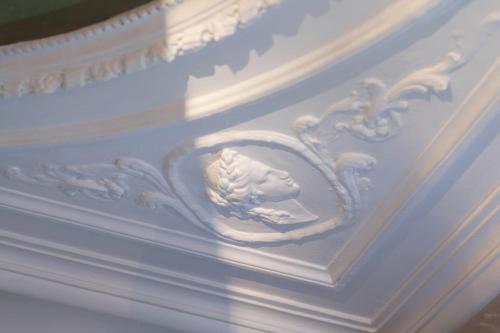 a white ceiling with a lion carving on it at Hotel & Spa Saint-Jacques in Paris
