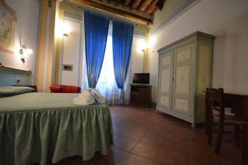 Letto o letti in una camera di Antica Residenza del Gallo
