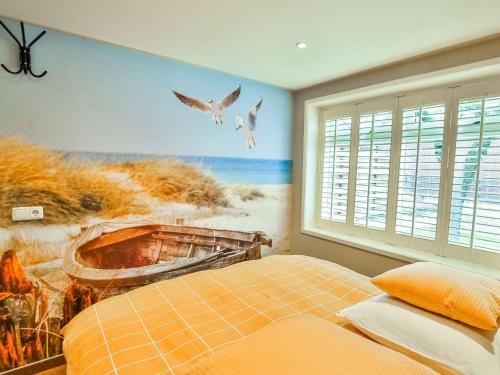 a bedroom with a painting of a boat and birds at Holiday home by the Wadden Sea in Paesens