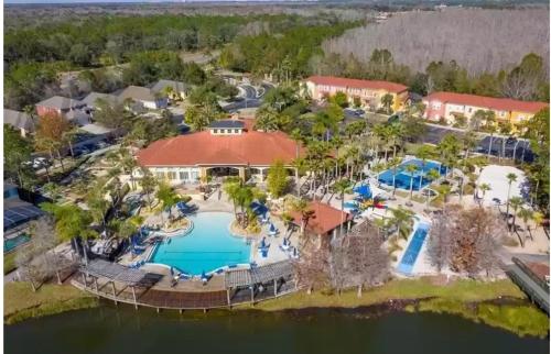 an aerial view of a resort with a swimming pool at Large 6BR Themed Family Villa Near Disney world in Kissimmee