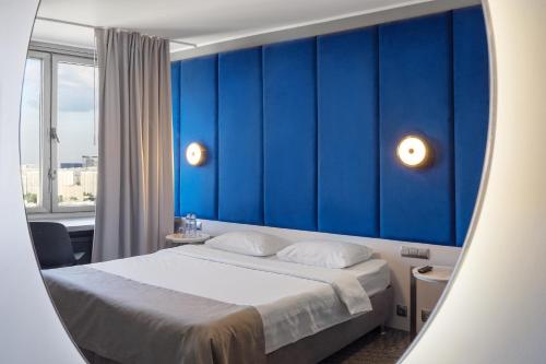 Säng eller sängar i ett rum på Astrus Hotel Moscow