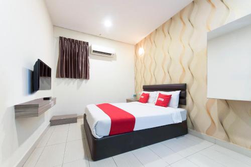 Krevet ili kreveti u jedinici u okviru objekta Super OYO 90385 H3 Hotel