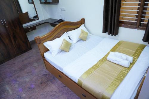 En eller flere senge i et værelse på Classia Suites