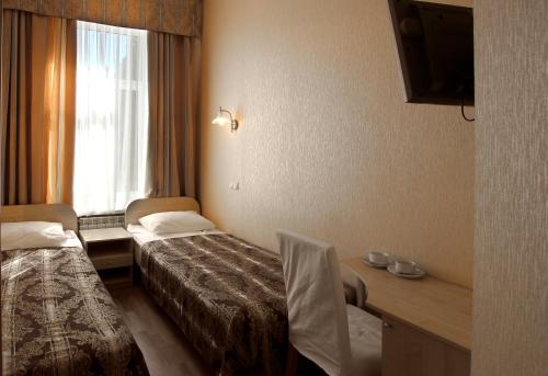 Ein Bett oder Betten in einem Zimmer der Unterkunft Bolshoy 45 Hotel