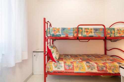a bedroom with two bunk beds in a room at Casa delle Poiane Costa Rei in Monte Nai
