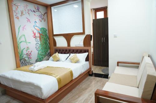 a bedroom with a bed and a window and a chair at Classia Suites in Bengaluru