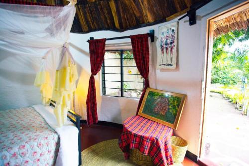 Кровать или кровати в номере Charming Eco-Homestay near Kilimanjaro International Airport