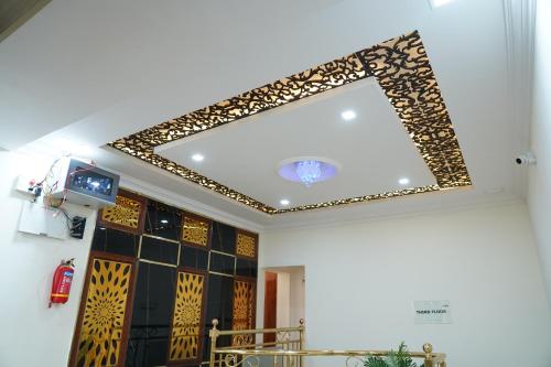 a mirror on the ceiling of a room at Classia Suites in Bengaluru