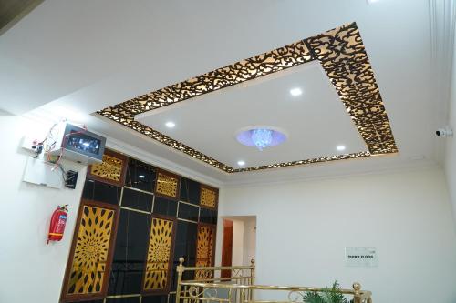 a mirror on the ceiling of a room at Classia Suites in Bengaluru