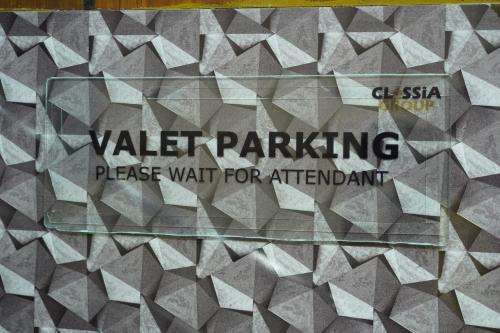 a sign that saysvalet parking preserve wait for attachment at Classia Suites in Bengaluru