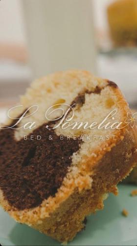 a piece of cake sitting on top of a plate at La Pomelia B&b Sofia in Trappitello