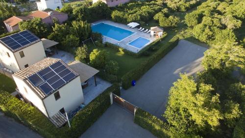 an aerial view of a house with solar panels on it at Ville dell'Eden con 9 camere da letto in 6 unità abitative in Lascari