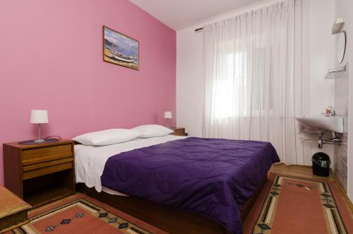 Postel nebo postele na pokoji v ubytování Guesthouse Moretic