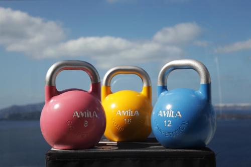 four pairs of dumbbells sitting on top of a table at Caldera's Dolphin Suites in Megalokhori