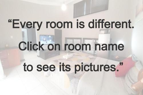 a room with a table and a sign that reads every room is different click on at Cozy Hatfield Condo in Pretoria