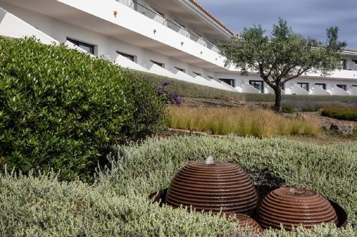 a fire hydrant in the middle of a grassy area at Hotel Sol Ixent in Cadaqués