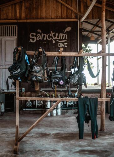 a group of motorcycles sitting on a table in a building at Sanctum Una Una Eco Dive Resort in Pulau Unauna