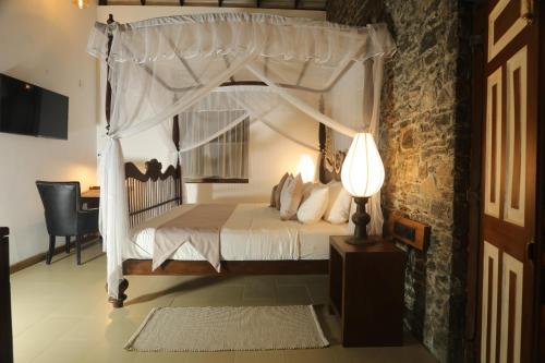 Tempat tidur dalam kamar di Stone Cottage