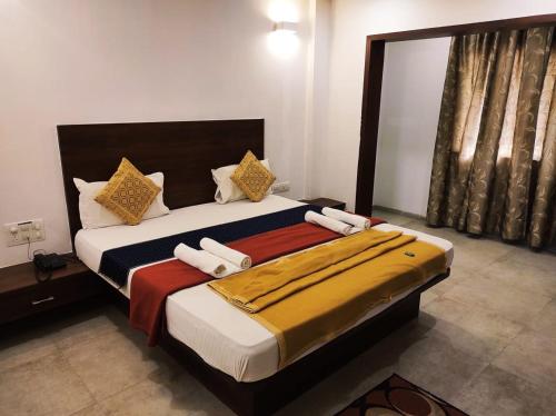 Hotel Manasi INNにあるベッド