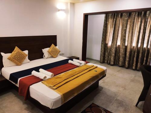 Hotel Manasi INNにあるベッド