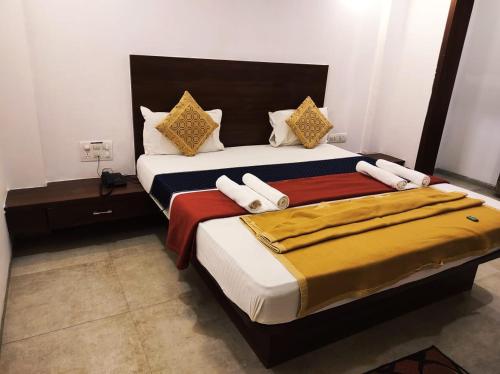 Hotel Manasi INNにあるベッド